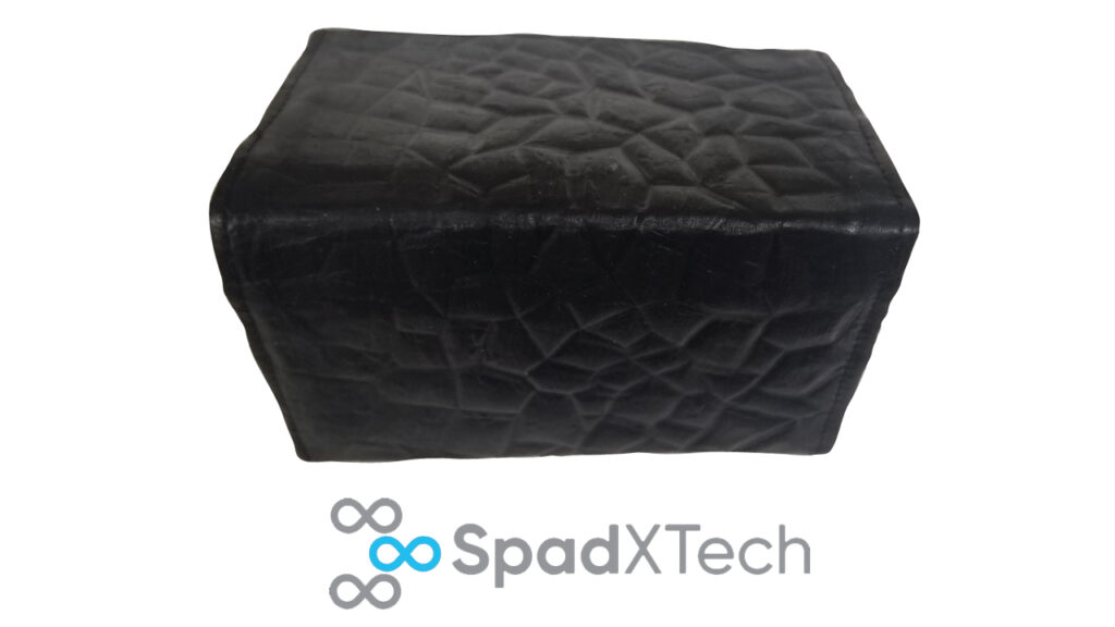 A bio-leather wallet and the SpadXTech logo.