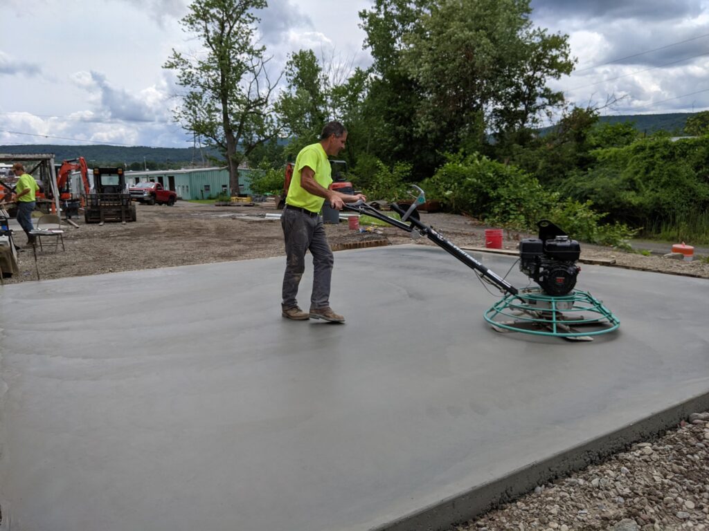 Smoothing concrete with KLAW Industries Pantheon on Old Mill Road