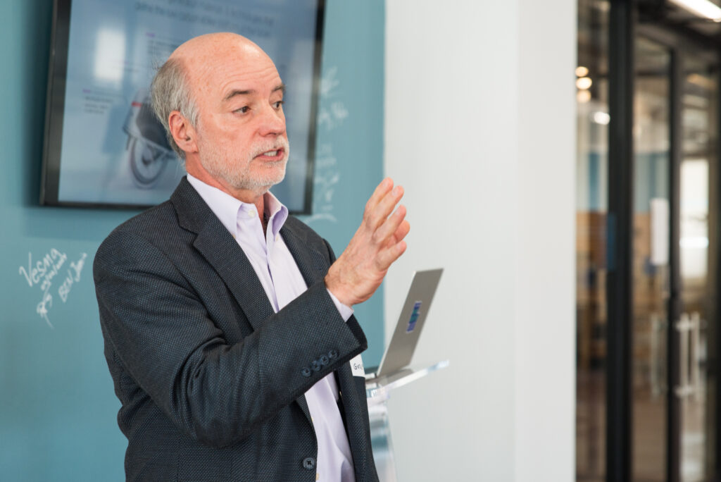 Ed Gilchrist, GYRE9 president and owner, introducing himself Networking at the ClimateHaven and FORGE Rocket Pitch event