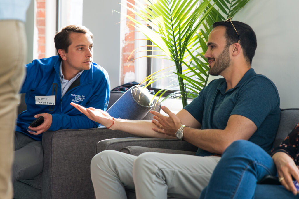 Conor Rooney (L) networking Networking at the ClimateHaven and FORGE Rocket Pitch event