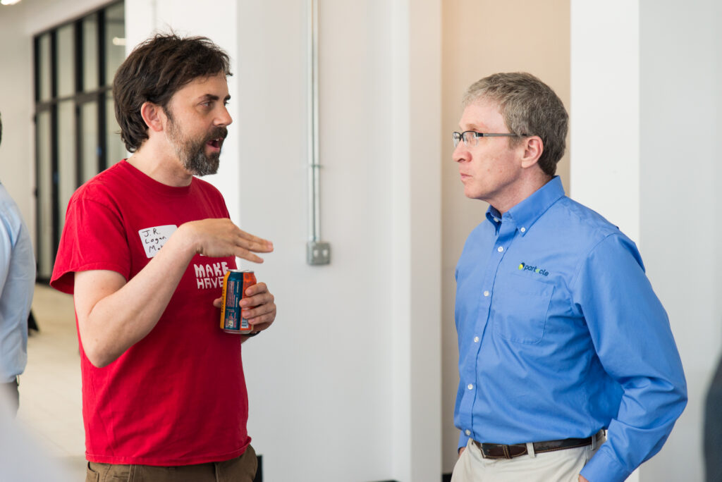 J.R. Logan and Alan Katze Networking at the ClimateHaven and FORGE Rocket Pitch event