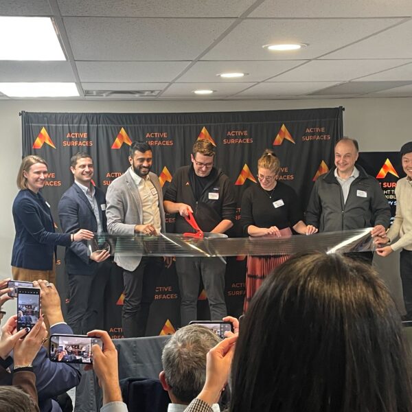 Dr. Richard Swartwout cutting the ribbon at Active Surfaces' new facility, with cofounder Shiv Bhakta and team members