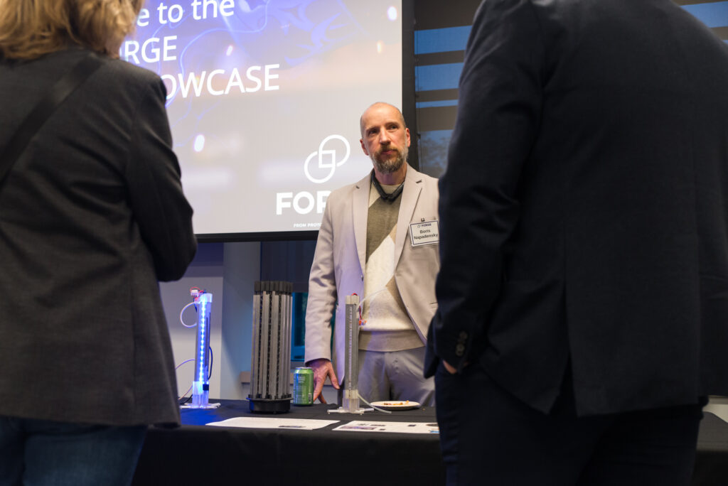 Lucciola Technologies table at the FORGE Fall Startup Showcase