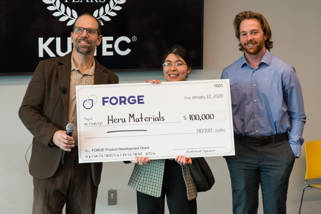 Hera Materials Junior Mechanical Engineer Tara Gensure accepting a first place FORGE Connecticut Product Development Grant for $100,000 of nondilutive physical product startup funding