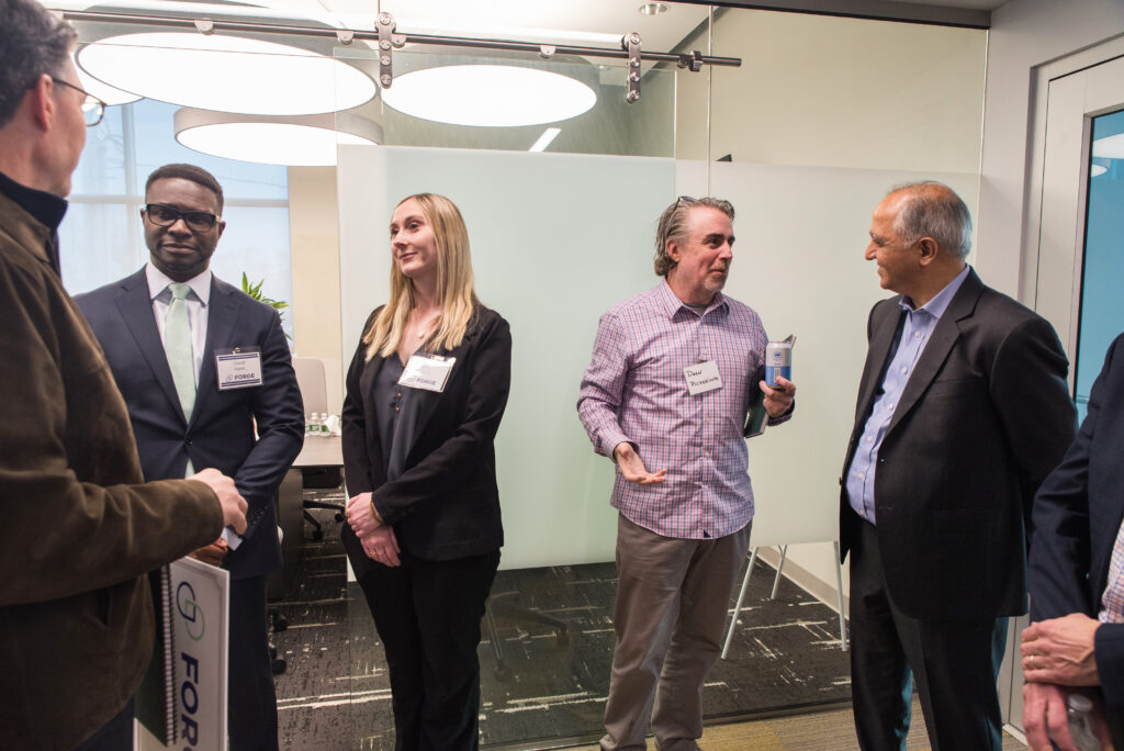 Networking at the KUBTEC Make It Here manufacturing celebration - M&T Bank David Femi and KUBTEC CEO and cofounder Vikram Butani 