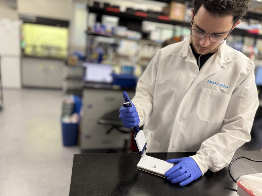 AtlasXomics medical research startup team member testing new physical product component